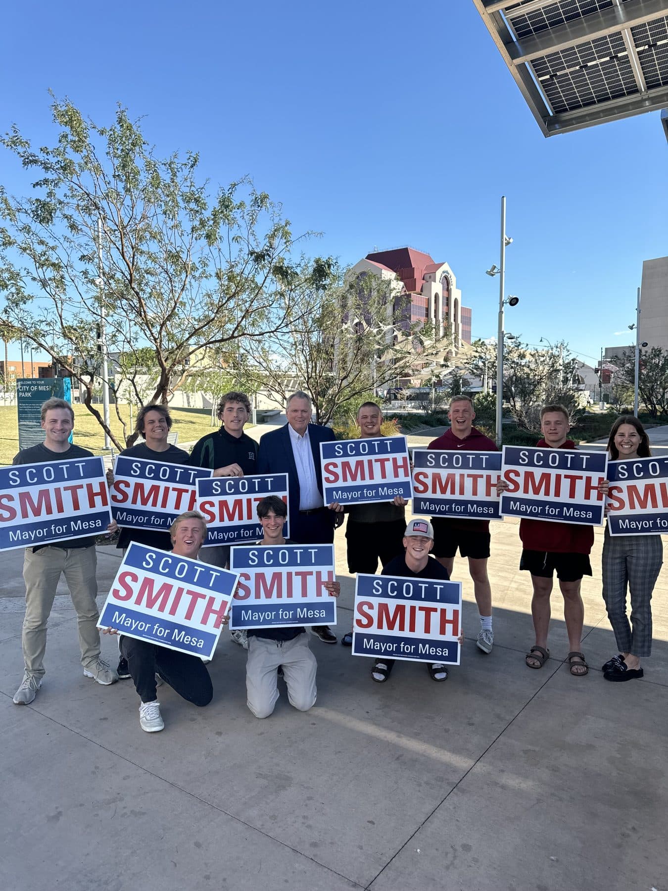 Saguaro Summit team at a candidate event with campaign signage